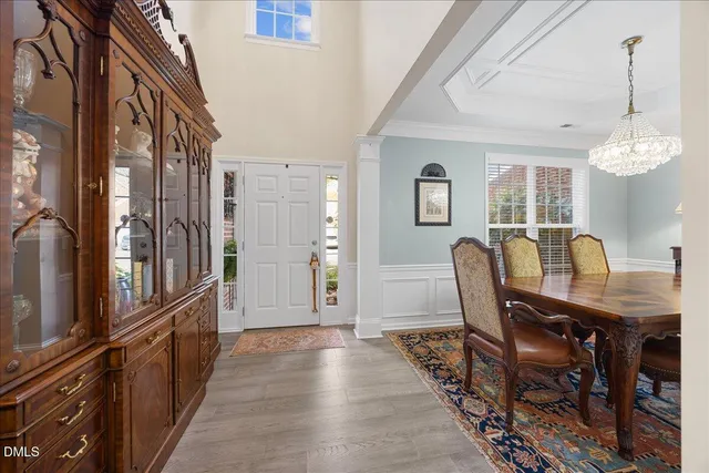a living room with stainless steel appliances kitchen island granite countertop furniture a rug and a view of kitchen