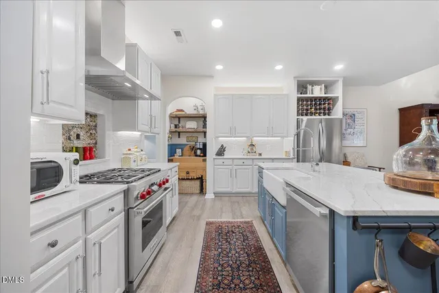 a kitchen with sink and cabinets