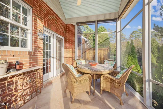 a bathroom with a shower and a glass door