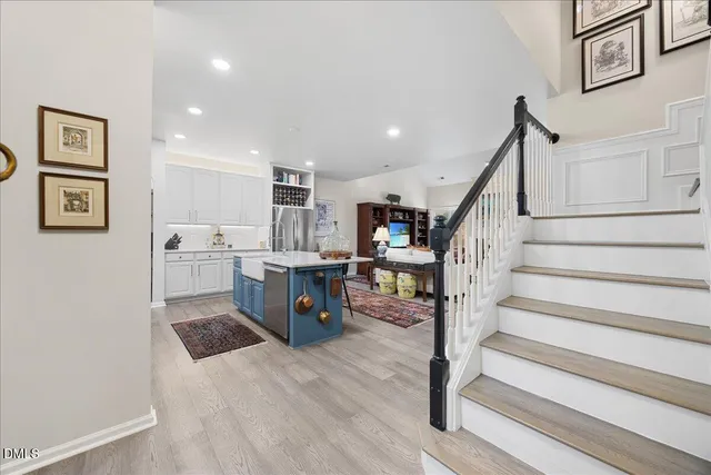 a living room with furniture and a lamp