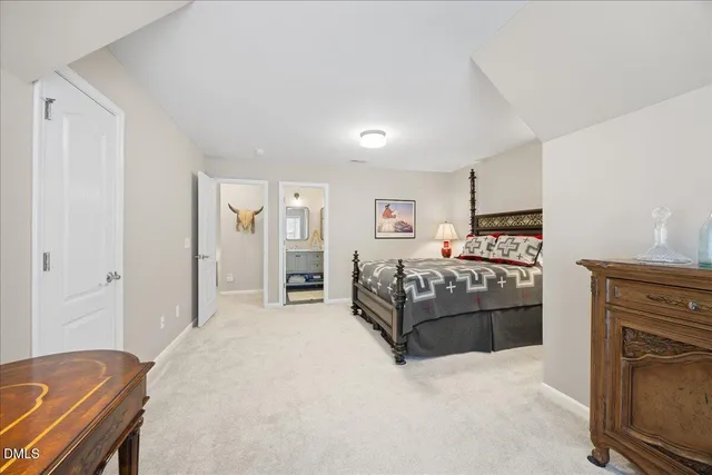 an aerial view of a house with a lake