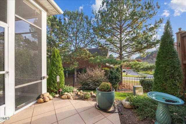 a view of a a dining room with furniture window and wooden floor