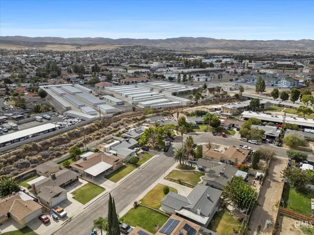 an aerial view of residential building with parking