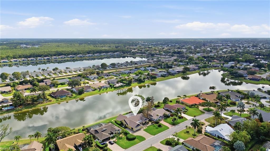 2274 Queens Way Naples, FL 34112 - Photo 25 of 28 an aerial view of residential houses with outdoor space and lake view in back