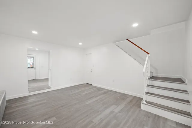 a picture of a bench in front of a wall