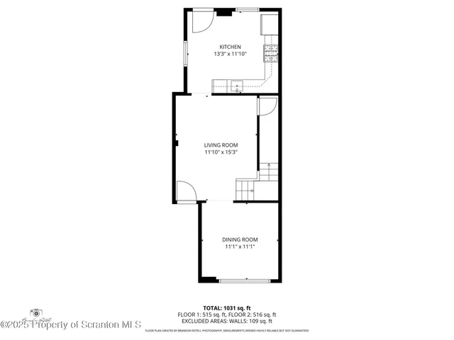 a picture of a bench in front of a wall