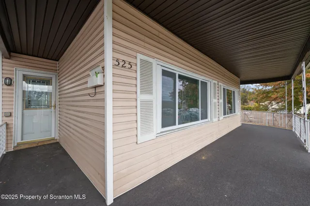 a view of a house with a large window