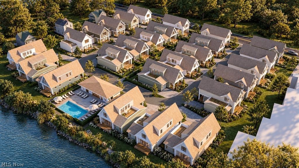 8 Lake Road East Geneva, OH 44041 - Photo 5 of 20 Waterfront community with multiple residential structures, a dedicated swimming pool, and manicured green spaces
