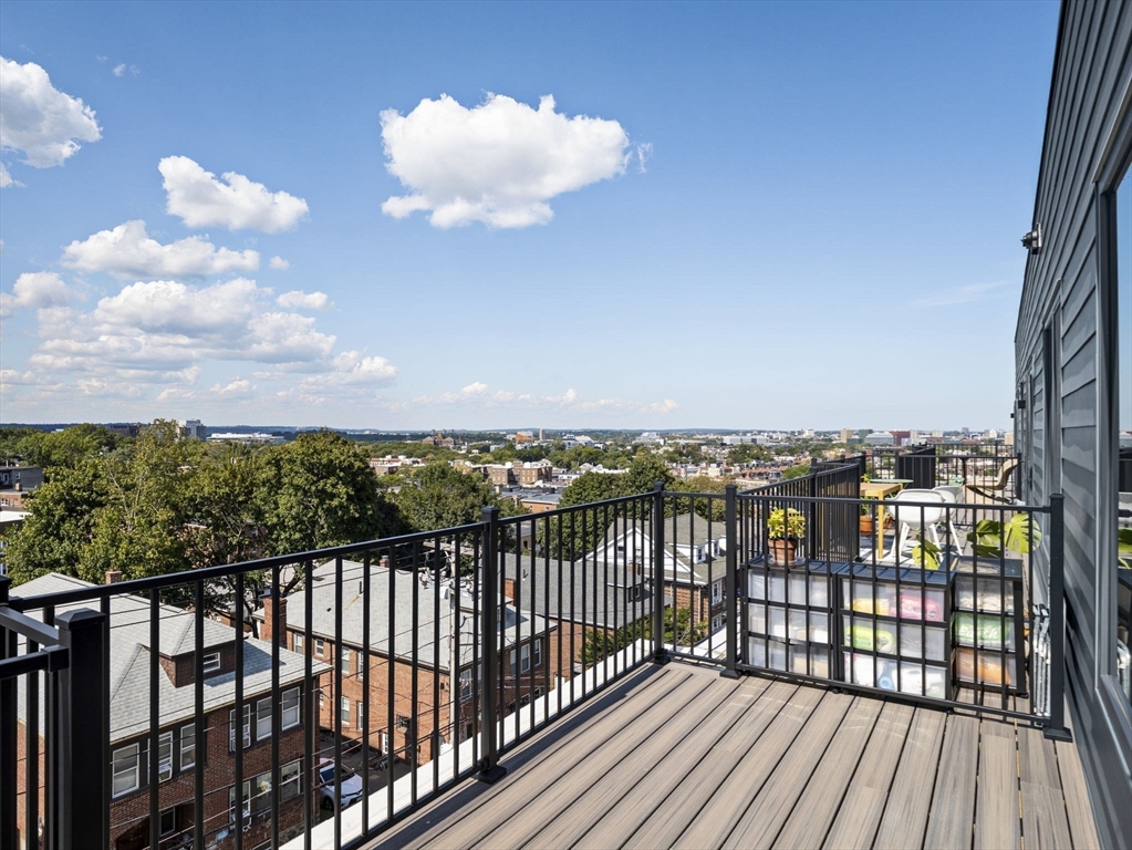 249 Corey Road, Unit 401 Boston, MA 02135 - Photo 24 of 34 a view of city from a balcony