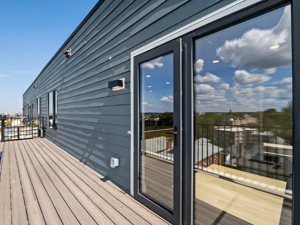 a view of a balcony with wooden floor