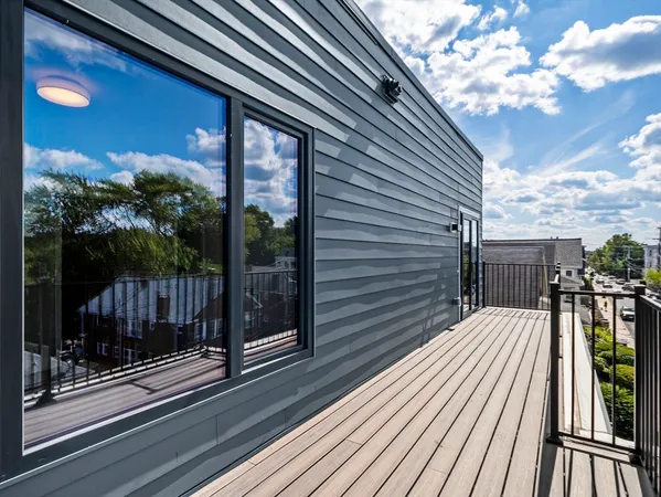 a view of a balcony with wooden floor