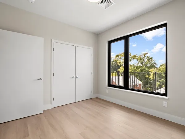 a view of an empty room with a window