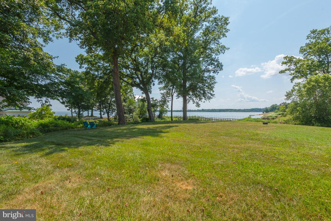 1411 Sharps Point Road Annapolis, MD 21409 - Photo 3 of 6 a view of swimming pool with an outdoor space and seating