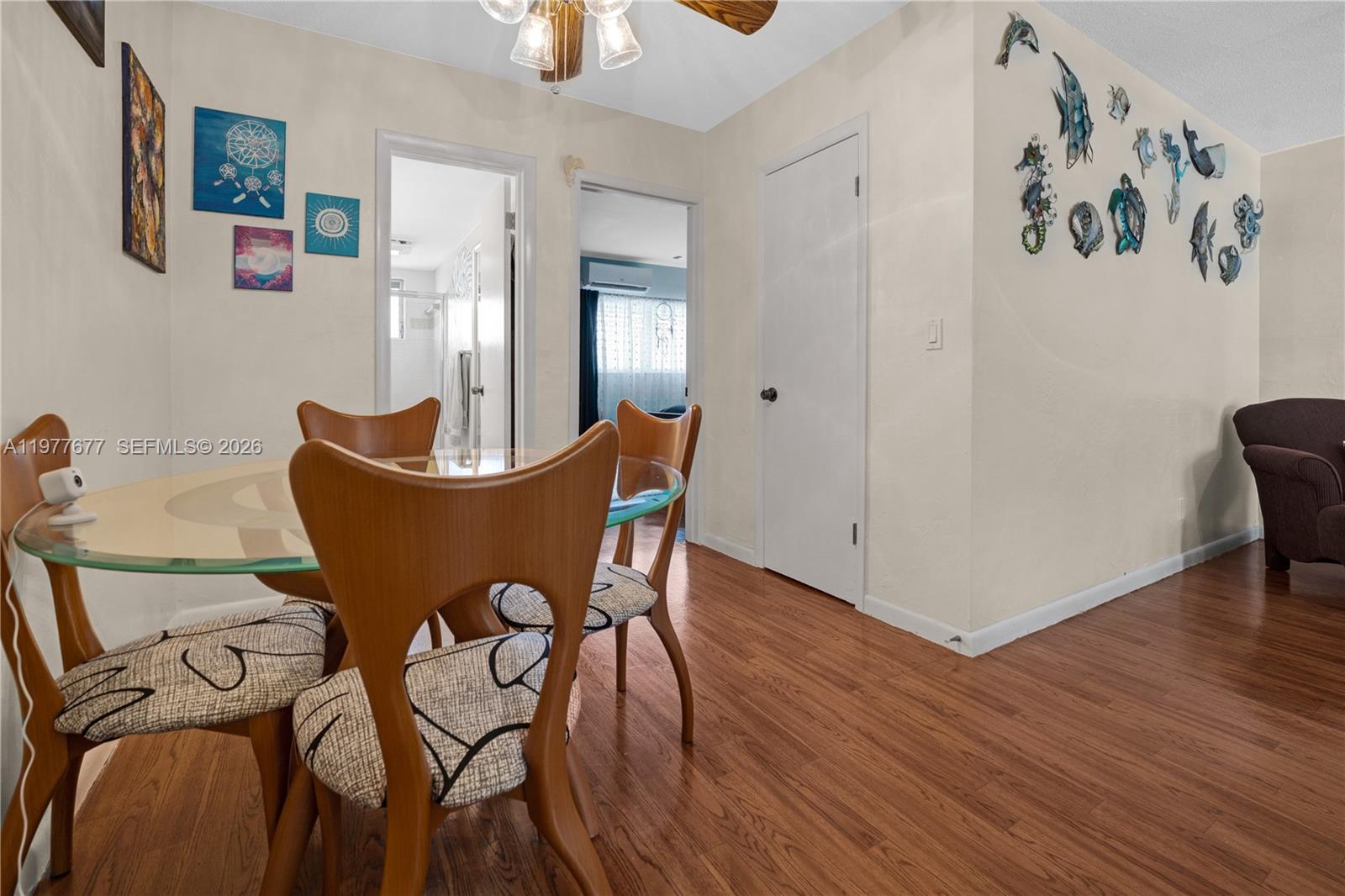 3701 Tyler Street, Unit 211 Hollywood, FL 33021 - Photo 12 of 26 a view of a room with furniture and wooden floor