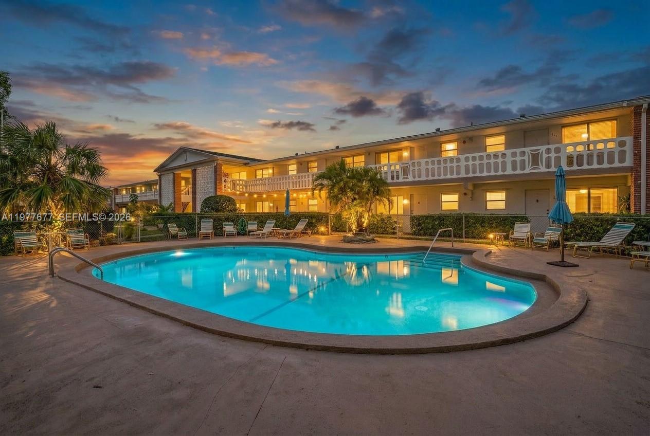 3701 Tyler Street, Unit 211 Hollywood, FL 33021 - Photo 2 of 26 a view of a swimming pool with outdoor seating
