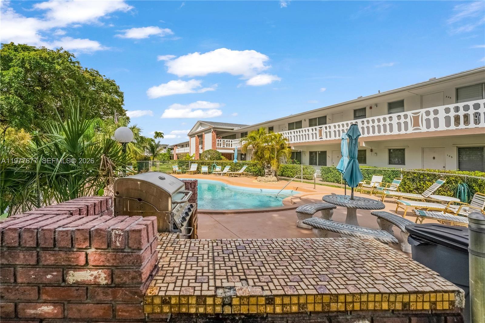 3701 Tyler Street, Unit 211 Hollywood, FL 33021 - Photo 21 of 26 a view of a house with a patio