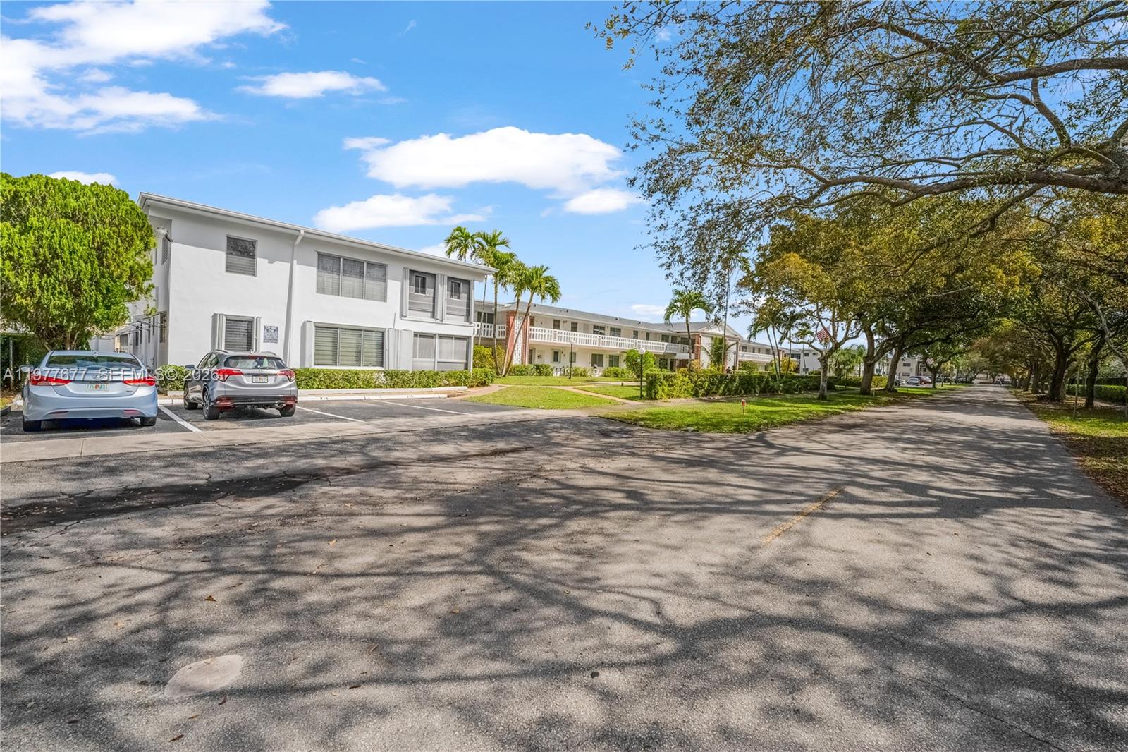 3701 Tyler Street, Unit 211 Hollywood, FL 33021 - Photo 22 of 26 a view of road with outdoor seating