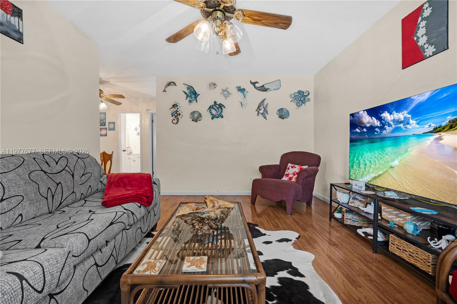 3701 Tyler Street, Unit 211 Hollywood, FL 33021 - Photo 7 of 26 a bedroom with furniture and a window