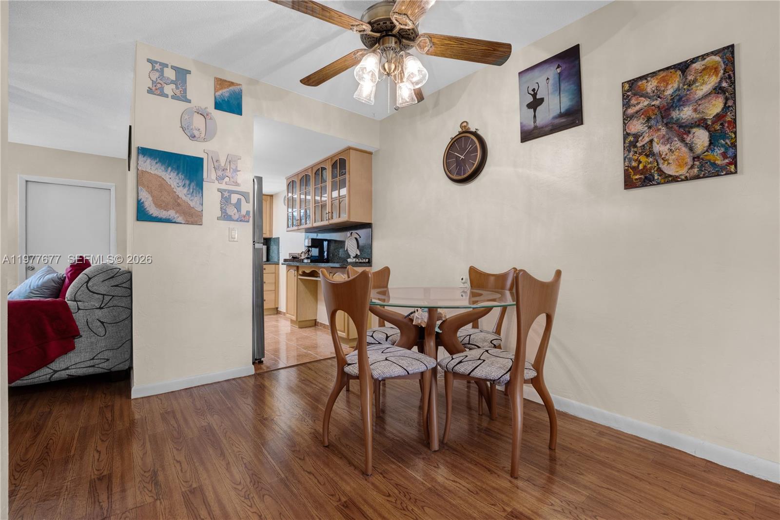3701 Tyler Street, Unit 211 Hollywood, FL 33021 - Photo 8 of 26 a view of a livingroom with furniture and wooden floor