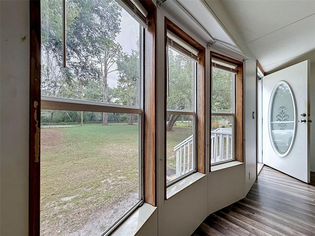 1819 Sinclair Hills Road Lutz, FL 33549 - Photo 17 of 60 a view of a glass door with a large window