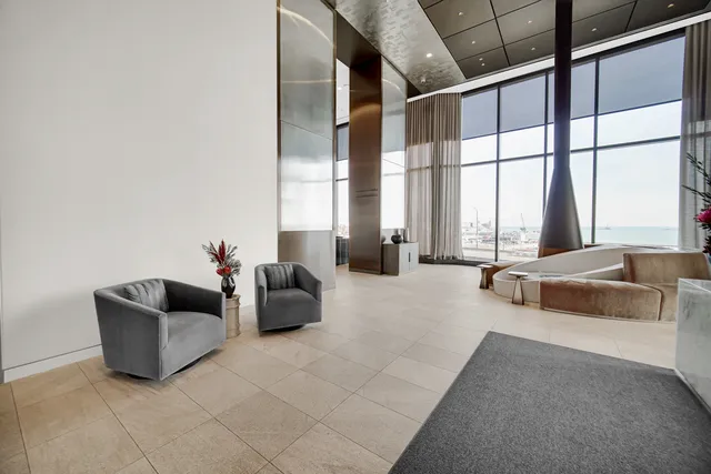 a living room with furniture and a bathtub