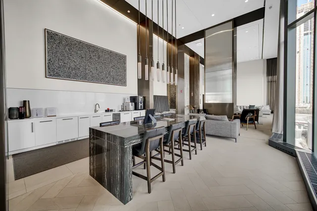 a view of a dining area with furniture and chandelier