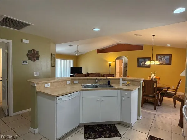 a kitchen with a sink and cabinets
