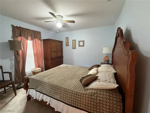a bedroom with a bed and cabinets