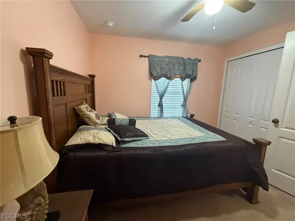 a bedroom with bed and window