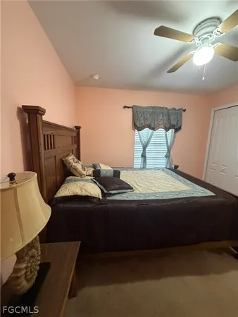 a bedroom with bed and window