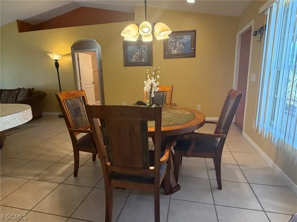 a view of a dining room with furniture and window