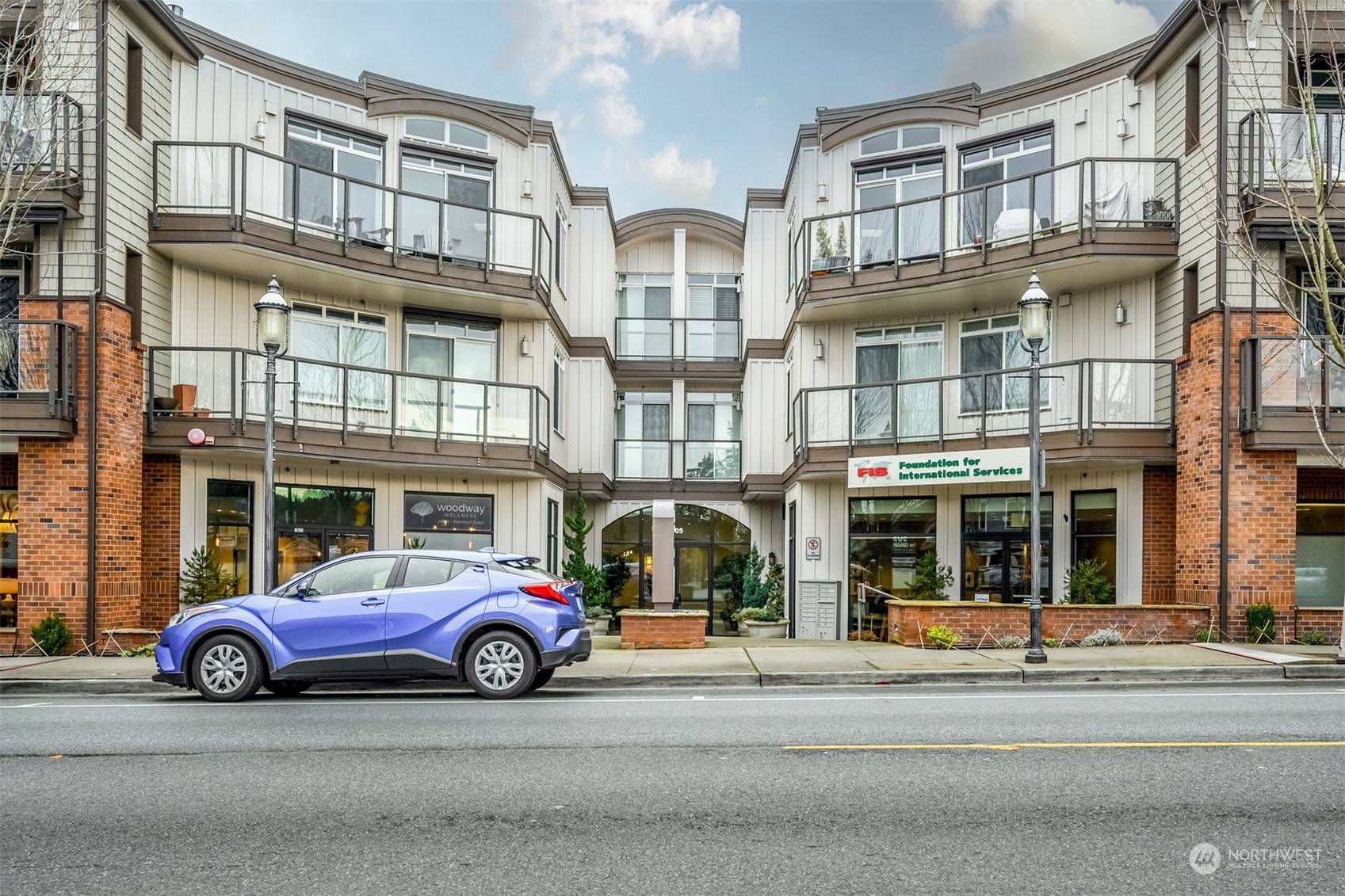 505 5th Avenue South, Unit 203 Edmonds, WA 98020 - Photo 1 of 24 a car parked in front of a building
