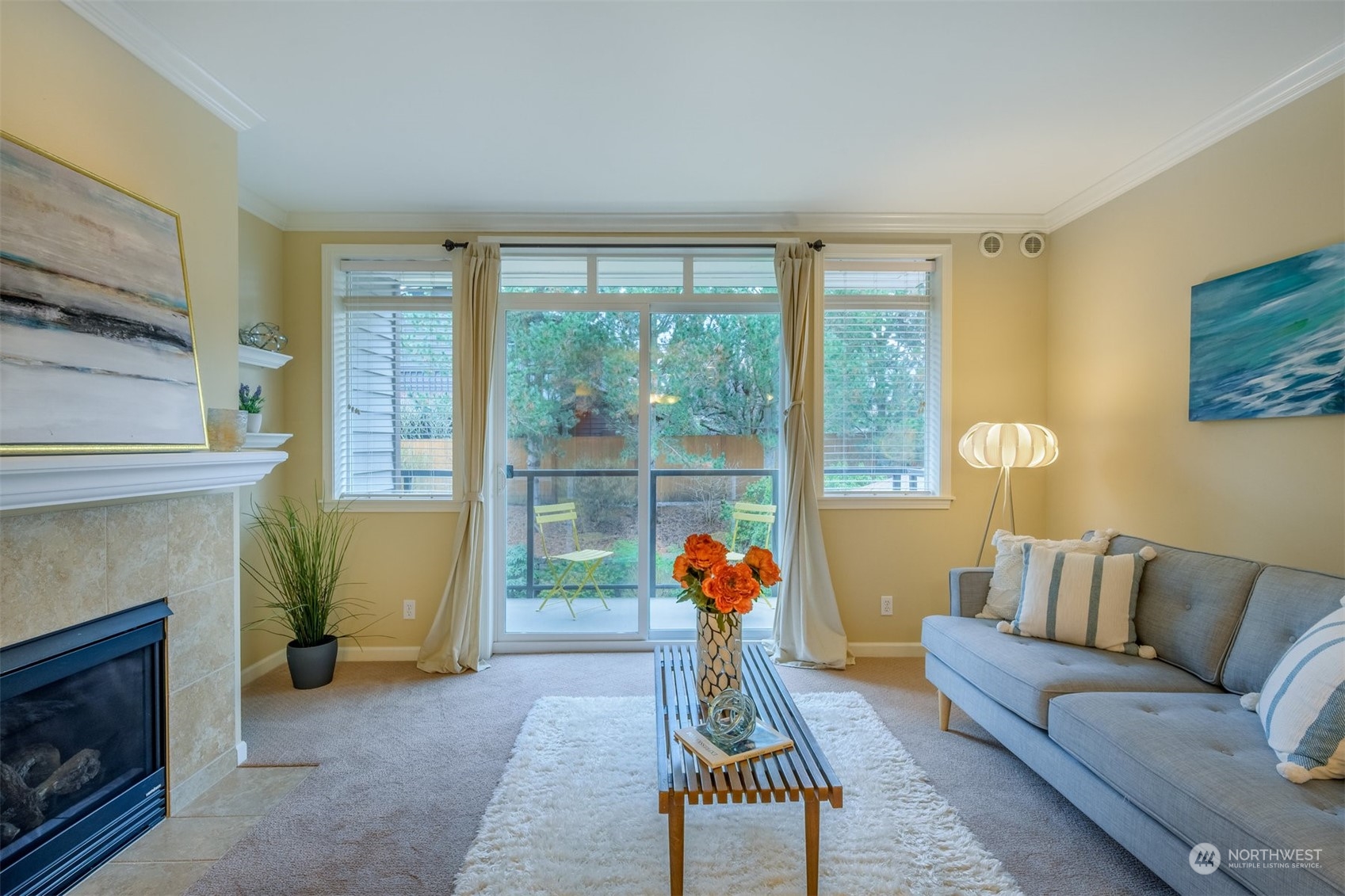 505 5th Avenue South, Unit 203 Edmonds, WA 98020 - Photo 11 of 24 a living room with furniture a window and a fireplace