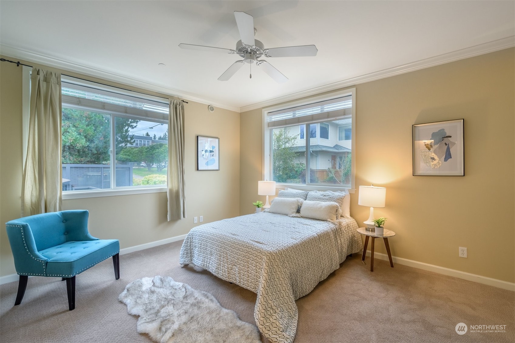 505 5th Avenue South, Unit 203 Edmonds, WA 98020 - Photo 13 of 24 a bedroom with a bed a couch and a window