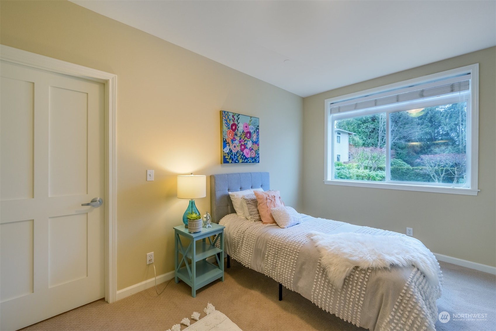 505 5th Avenue South, Unit 203 Edmonds, WA 98020 - Photo 16 of 24 a bedroom with a bed and a window