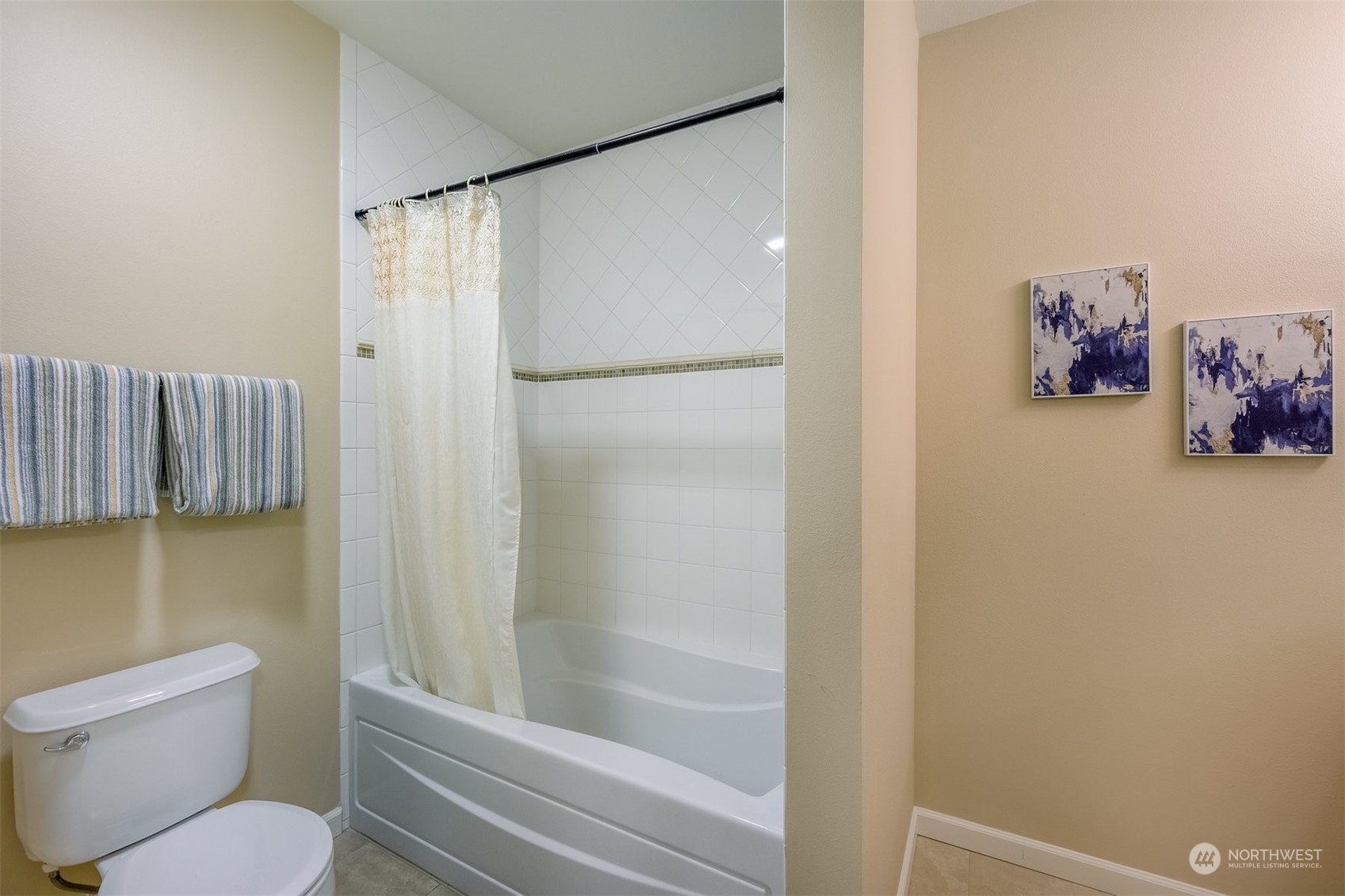 505 5th Avenue South, Unit 203 Edmonds, WA 98020 - Photo 17 of 24 a bathroom with a shower and a toilet
