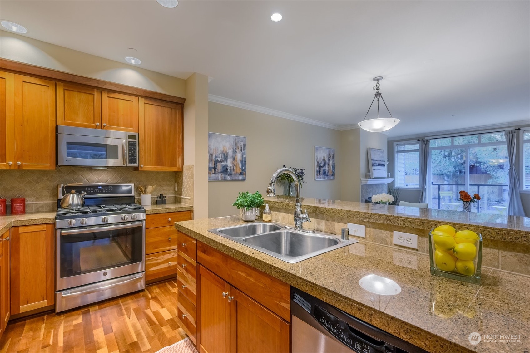 505 5th Avenue South, Unit 203 Edmonds, WA 98020 - Photo 3 of 24 a kitchen with a sink appliances and cabinets