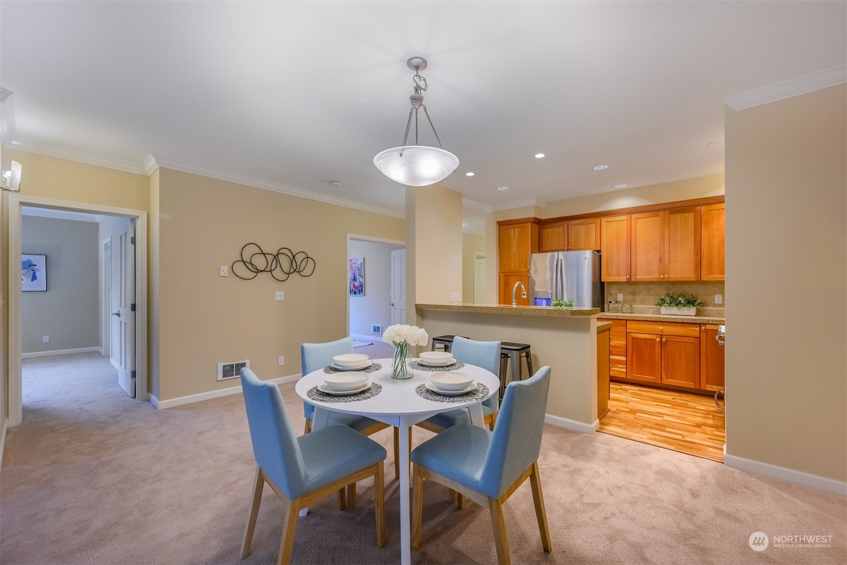 505 5th Avenue South, Unit 203 Edmonds, WA 98020 - Photo 7 of 24 a view of a dining room with furniture and wooden floor