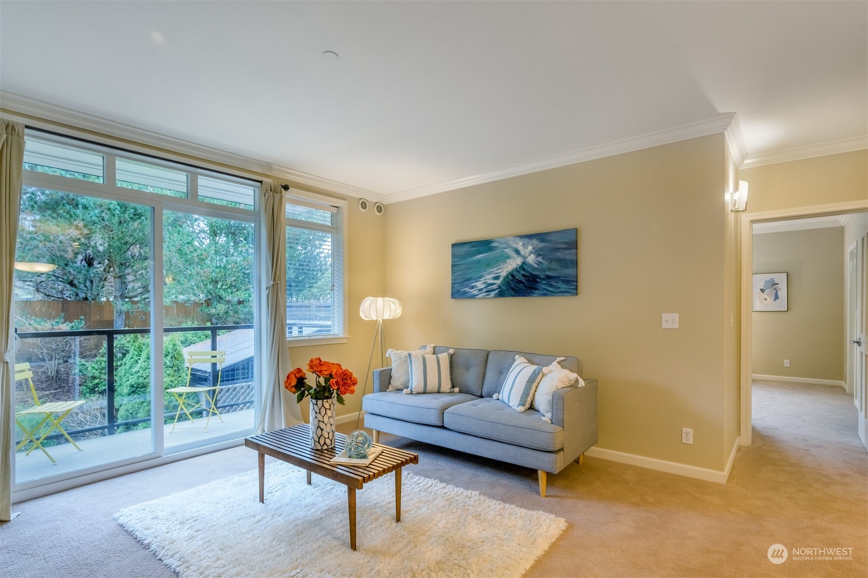 505 5th Avenue South, Unit 203 Edmonds, WA 98020 - Photo 10 of 24 a living room with furniture and a floor to ceiling window