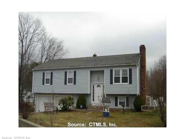 1059 North Colony Road Meriden, CT 06450 - Photo 1 of 1 a front view of a house with a yard