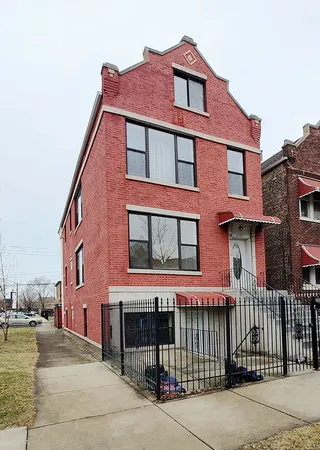 a red brick building that has lot of windows on it