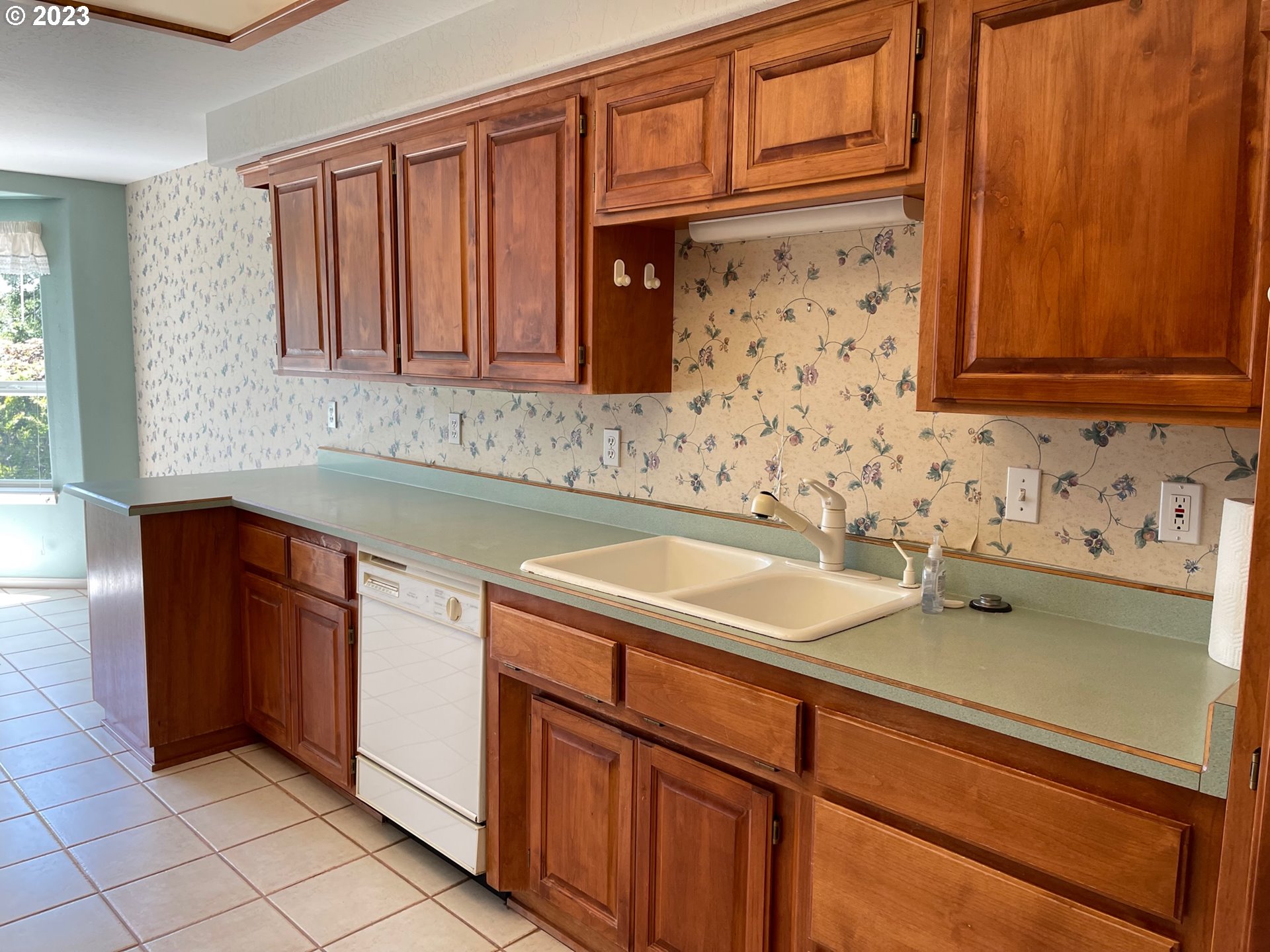 919 3rd Street Brookings, OR 97415 - Photo 17 of 36 a bathroom with a sink and a mirror