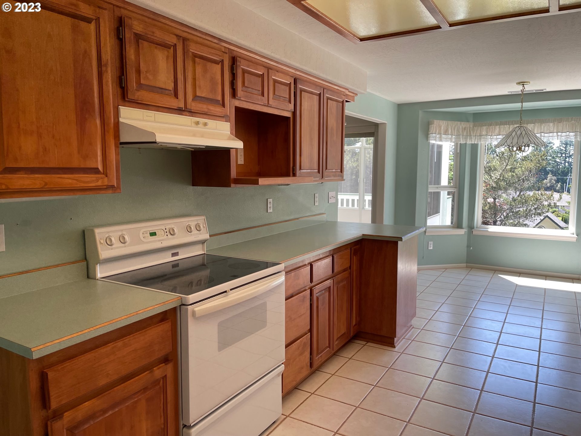 919 3rd Street Brookings, OR 97415 - Photo 18 of 36 a kitchen with a stove sink and cabinets