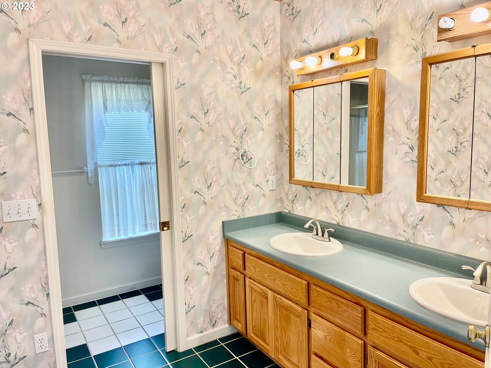 919 3rd Street Brookings, OR 97415 - Photo 22 of 36 a bathroom with a sink and a mirror