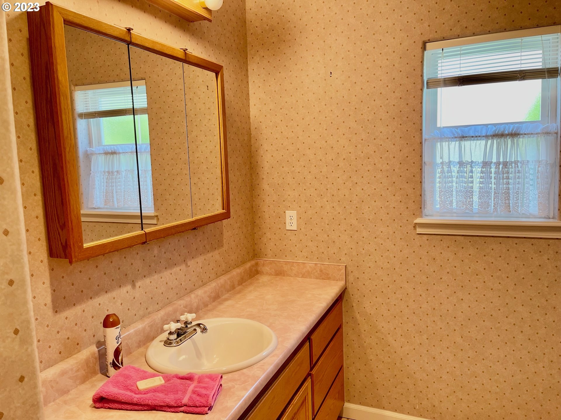 919 3rd Street Brookings, OR 97415 - Photo 26 of 36 a bathroom with a tub and a sink