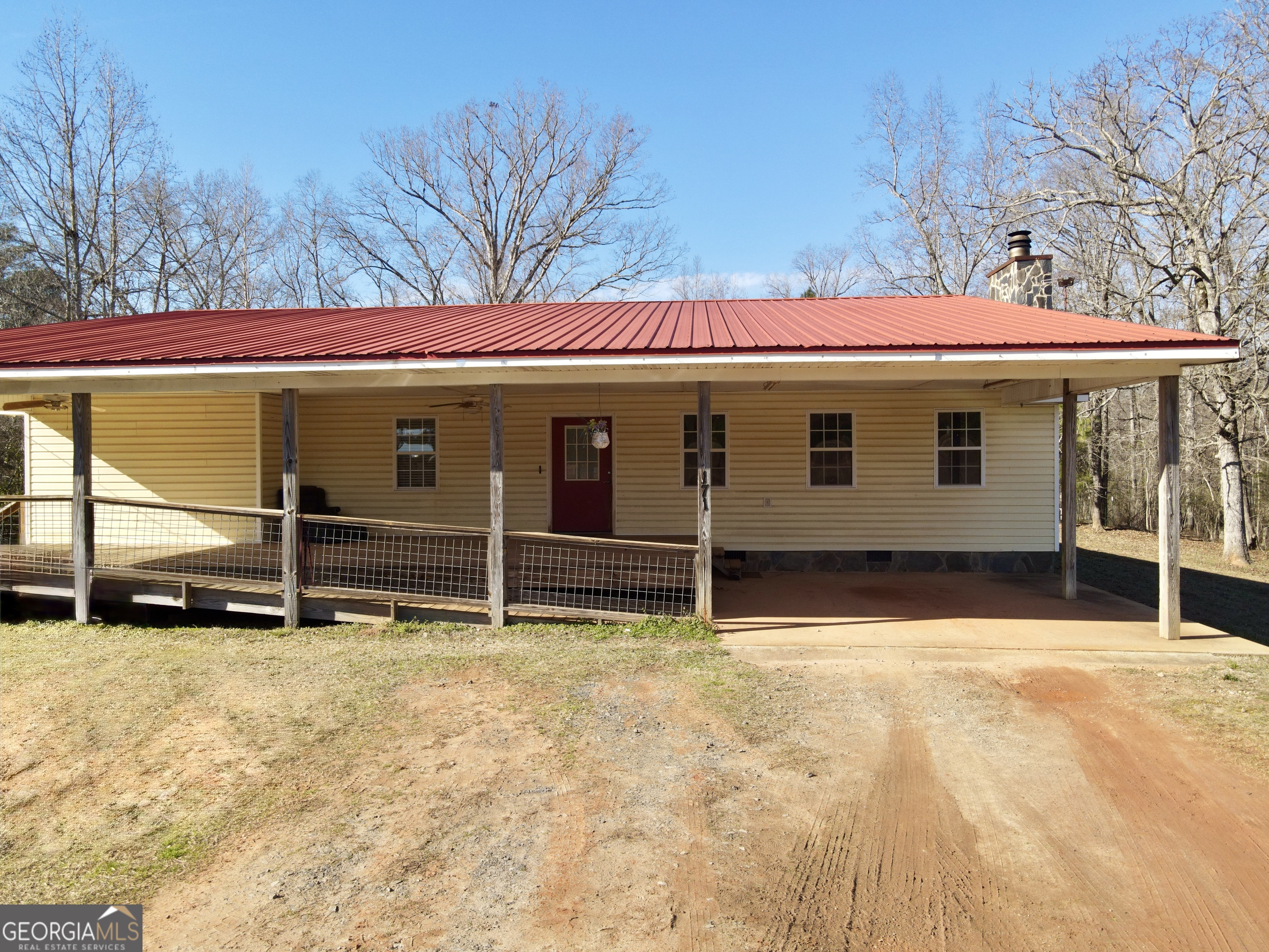 171 Hoyt Road Milner, GA 30257 - Photo 2 of 26 a view of a house with a yard