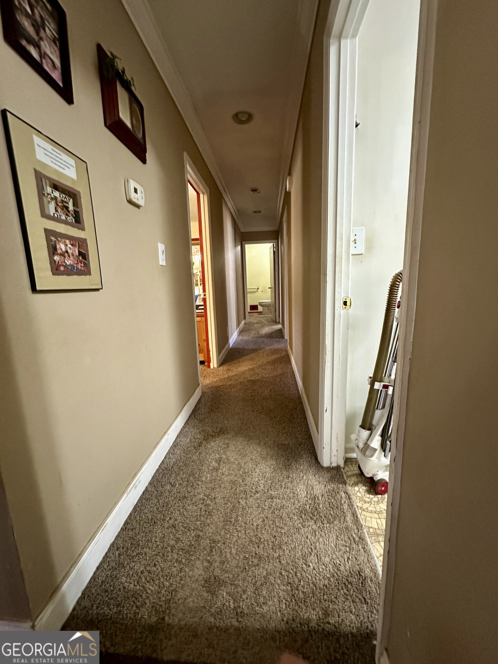 171 Hoyt Road Milner, GA 30257 - Photo 21 of 26 a view of a hallway with wooden floor and staircase