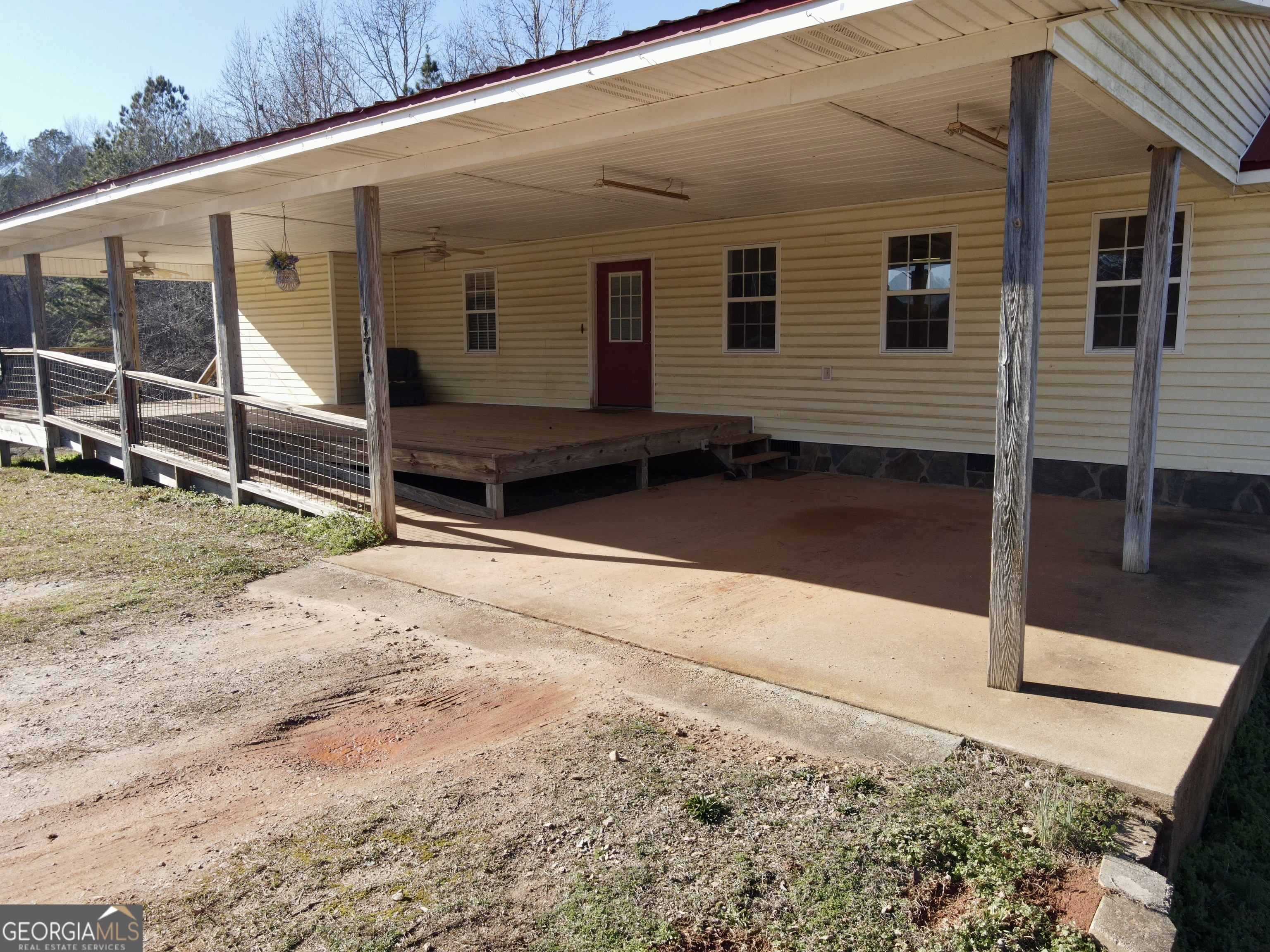 171 Hoyt Road Milner, GA 30257 - Photo 3 of 26 a view of a house with a backyard