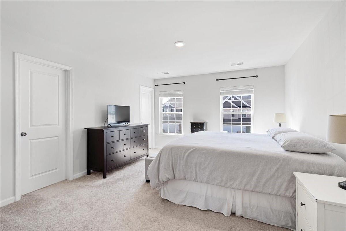 7730 Sea Turtle Way Lancaster, SC 29720 - Photo 15 of 24 a bedroom with a bed and dresser