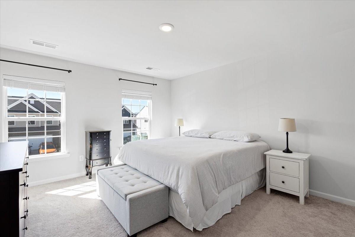 7730 Sea Turtle Way Lancaster, SC 29720 - Photo 16 of 24 a bedroom with a bed and a couch